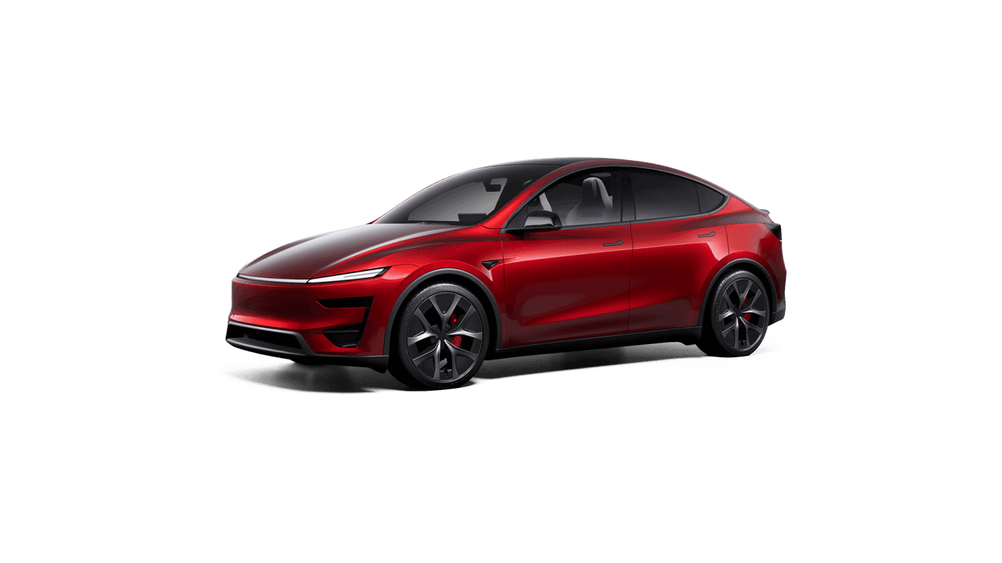 A Tesla Model Y Performance in Ultra Red, seen from the front three-quarter.